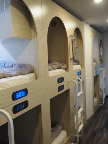 Postel nebo postele na pokoji v ubytování Coller Chinatown