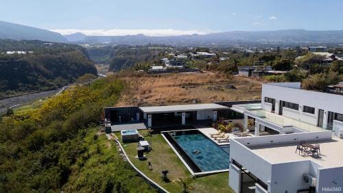 an aerial view of a house with a swimming pool at La Villa Phoenix in Saint-Pierre