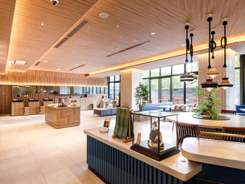 a lobby of a hospital with a waiting room at Nishitetsu Hotel Croom Hakata Gion Kushida Shrine in Fukuoka