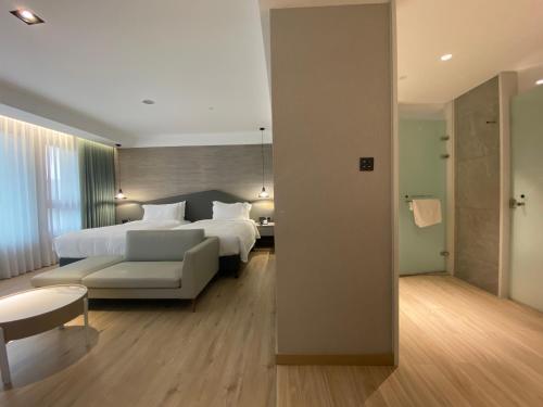En eller flere senge i et værelse på Wyndham Sun Moon Lake