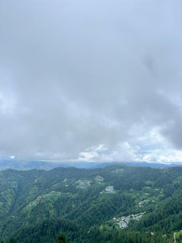 a view from the top of a mountain with trees at Fortune Park Kufri, Shimla - Member ITC Hotels' Group in Shimla