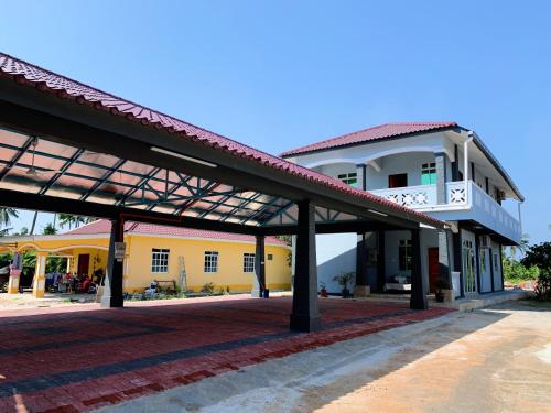 a building with a pavilion in front of it at Tokwan Homestay, Alor Setar Kedah in Alor Setar
