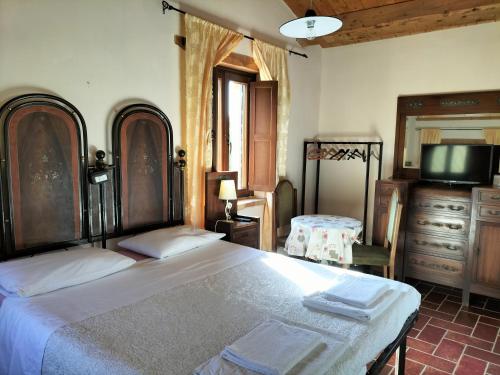 Posteľ alebo postele v izbe v ubytovaní Agriturismo Biologico la Casa degli Gnomi