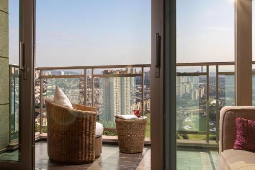 a room with a view of a city from a window at Crowne Plaza Chongqing New North Zone by IHG in Chongqing