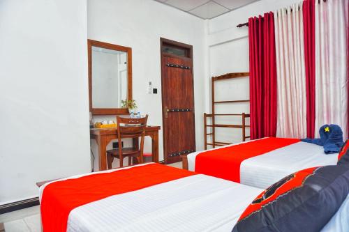 Postel nebo postele na pokoji v ubytování Sashini Homestay
