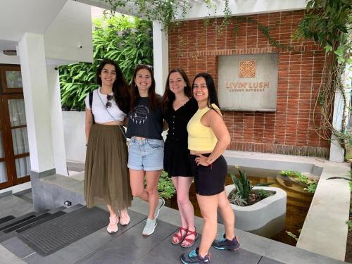 a group of women standing in front of a building at Livin Lush Luxury Retreat in Anuradhapura