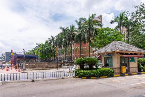 a building with a gazebo next to a street at Guangzhou He She Art Apartment in Guangzhou
