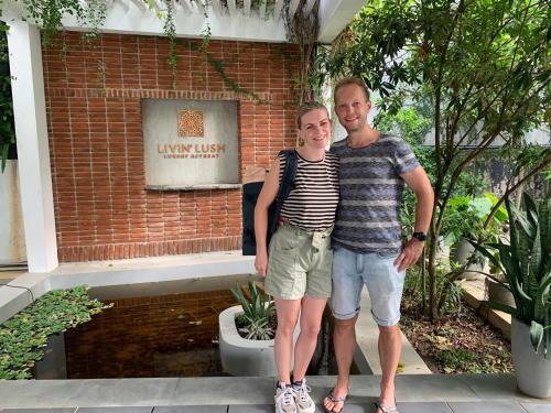 a man and a woman standing in front of a building at Livin Lush Luxury Retreat in Anuradhapura