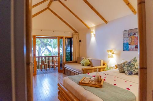 Postel nebo postele na pokoji v ubytování Ecoboo Maldives
