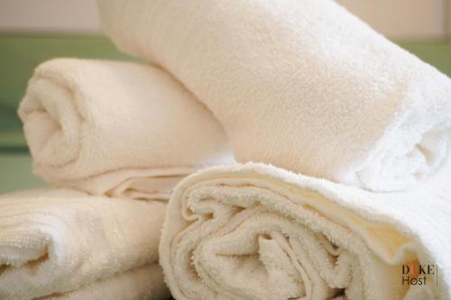 a pile of white towels sitting next to each other at Chamartin Centro Norte Apartment in Madrid