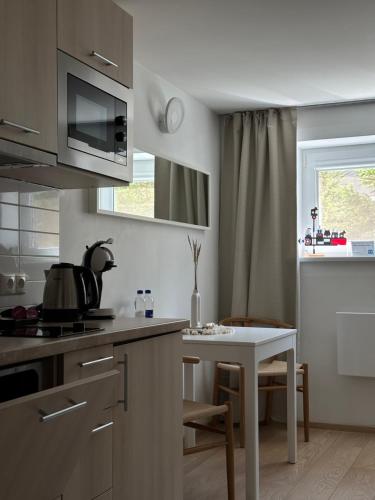 Nhà bếp/bếp nhỏ tại Nidos Palvė Ground Zero