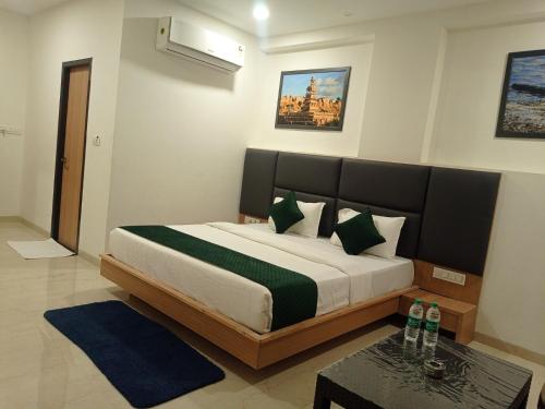 a bedroom with a large bed in a room at Sun Stone Hotel & Club - Jawai in Sheoganj
