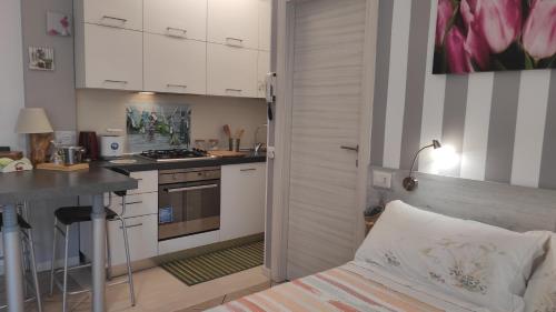 Kuchyňa alebo kuchynka v ubytovaní Como Petite Maison