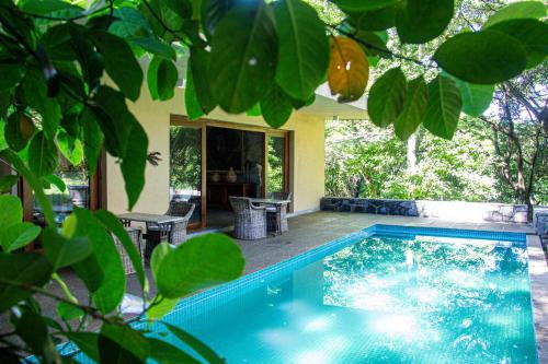a swimming pool in the middle of a yard at Cobalt Villa by The Serendipity Collection in Kandy