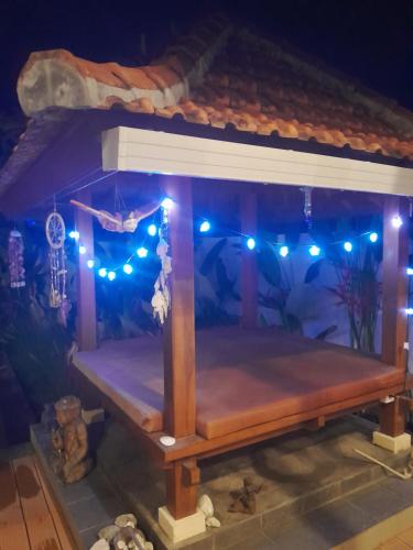 a model of a bed in a aquarium at night at The Seaglass Villas Bingin in Uluwatu