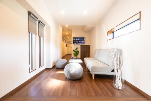 a living room with a couch and a table at M Park in Fukuoka