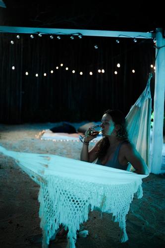 a woman is sitting in a tub with a veil at Cristal Blue Barú in Baru