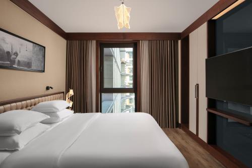 Ένα ή περισσότερα κρεβάτια σε δωμάτιο στο Sheraton Istanbul City Center