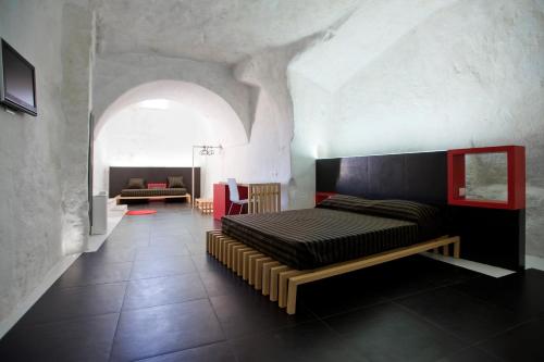 Un ou plusieurs lits dans un hébergement de l'établissement Basiliani Hotel