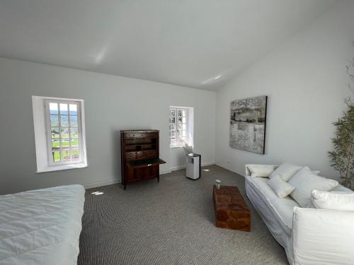 a living room with a couch and a table at Bastide du Luberon in Apt