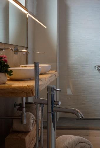 a bathroom with a sink and a mirror at Tenuta d'Arbia, Siena in Monteroni dʼArbia