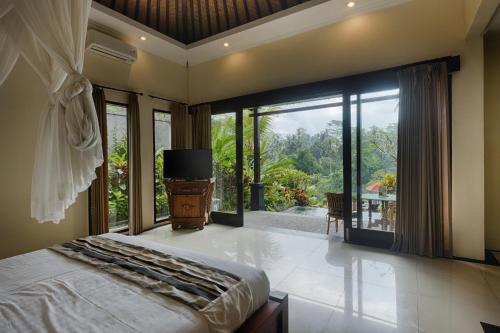Katil atau katil-katil dalam bilik di Kaja Villa