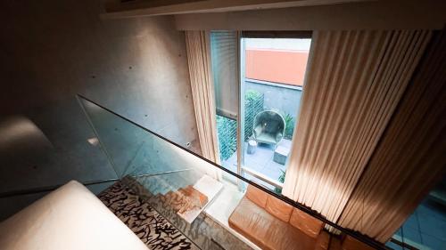 an overhead view of a room with a window at M Social Singapore in Singapore