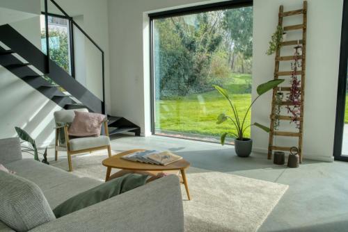 a living room with a couch and a table at Vakantiewoning DRP29 in Zelem