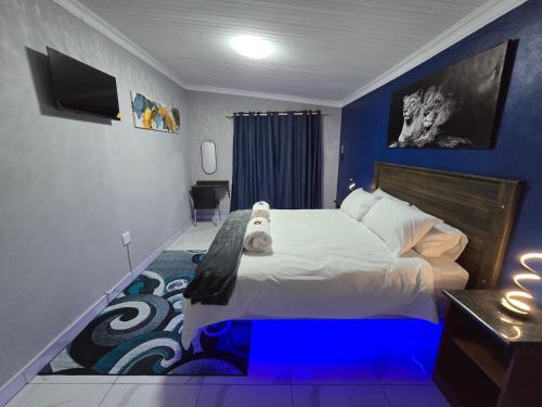 Postel nebo postele na pokoji v ubytování Impala Palms Guesthouse