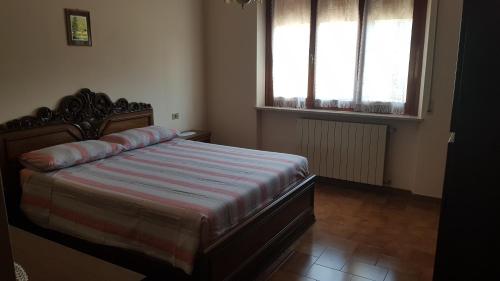 Ένα ή περισσότερα κρεβάτια σε δωμάτιο στο VILLA DUE TIGLI