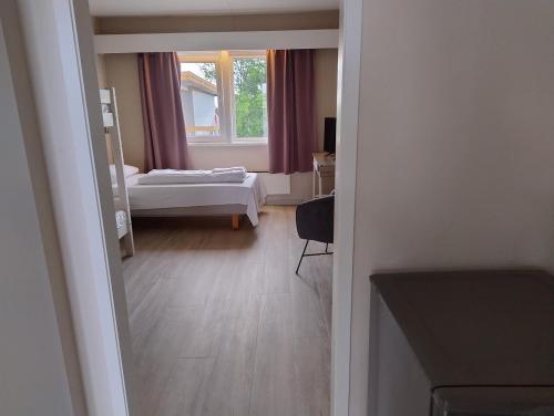 Postel nebo postele na pokoji v ubytování Holms Motel Larvik