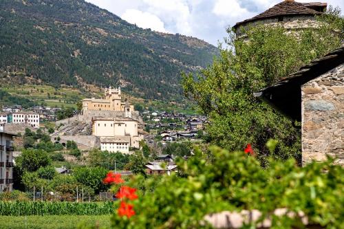 a view of a town with a mountain at Alloggio La Tour in Saint-Pierre