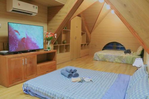 TH Villa, Vinhome Ocean Park, Hanoiにあるベッド