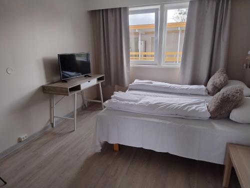 Postel nebo postele na pokoji v ubytování Holms Motel Larvik