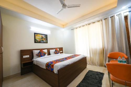 Postel nebo postele na pokoji v ubytování FabHotel Muktinath