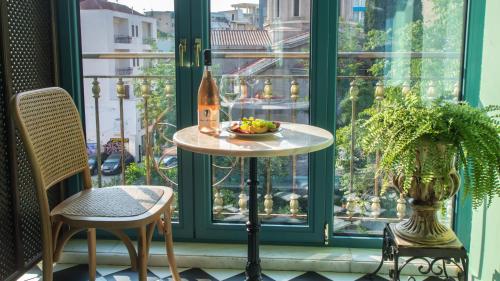 a table in front of a window with a bowl of fruit at Juan Rodriguez Hacienda in Athens