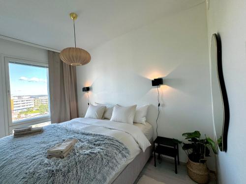 Ένα ή περισσότερα κρεβάτια σε δωμάτιο στο Nordic City suite