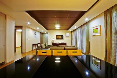 a living room with a couch and a table at High1 Condominium in Jeongseon