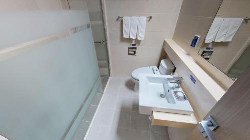 a bathroom with a sink and a toilet at High1 Condominium in Jeongseon