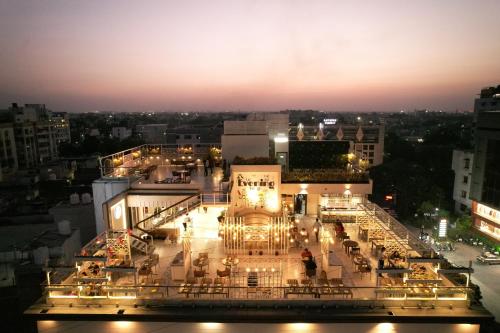a view of a building with lights at night at Alba Premier, Indore in Indore