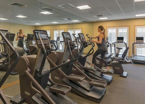 two women running on treadmills in a gym at Hyatt Regency Coconut Point Resort & Spa Near Naples in Bonita Springs
