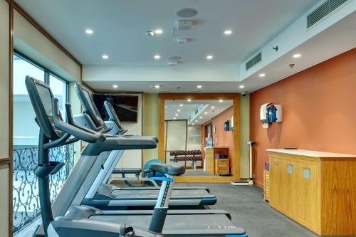 a gym with cardio equipment in a hotel room at Hilton Gdansk in Gdańsk
