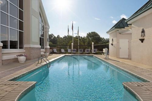 a swimming pool in the backyard of a house at Homewood Suites by Hilton Raleigh-Durham Airport at RTP in Durham