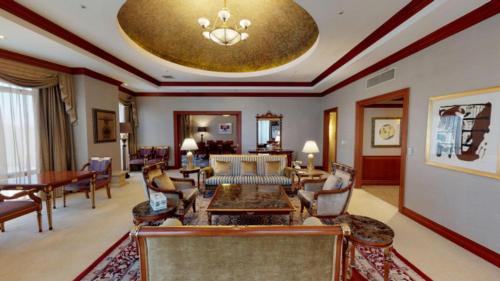 a living room filled with furniture and a gold ceiling at High1 Grand Hotel Main Tower in Jeongseon