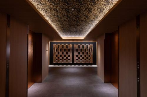 a hallway with a ceiling in a building at Hilton Kyoto in Kyoto