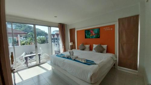 Postel nebo postele na pokoji v ubytování Phuket Racha Kata Homestay