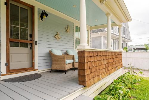 a front porch of a house with a door at Historic Seaside Downtown Mystic Home Walk to Seaport in Stonington