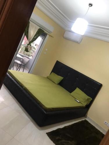 En eller flere senge i et værelse på Residence Onalo Yoff