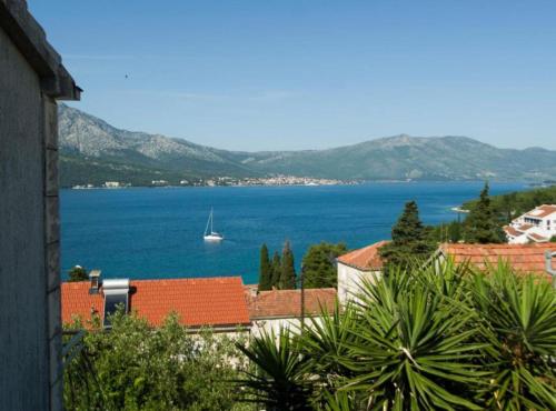 a view of a large body of water with a boat at Apartment Jurišić Korčula in Korčula
