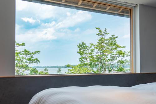 Postel nebo postele na pokoji v ubytování Hotel Kitanoya